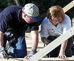President George W. Bush and Johana Rodriguez working on her Habitat for Humanity house