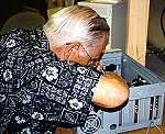 Volunteer Scott Haselwood rebuilding a used computer